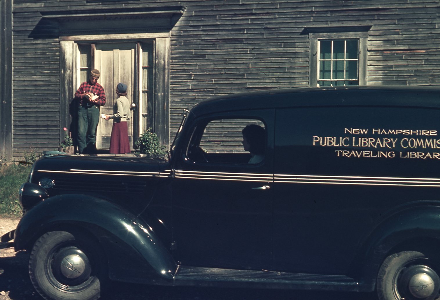 The bookmobile stops at a rural house.